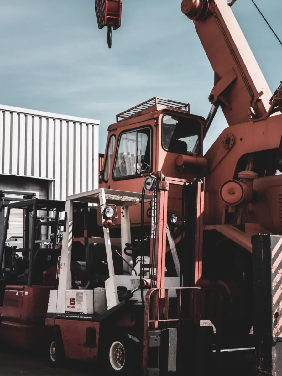 Forklift and crane at a cargo terminal