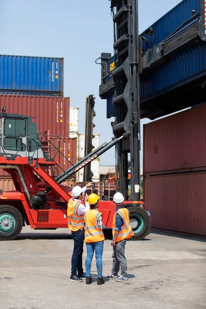 Logistics team inspecting containers at a port