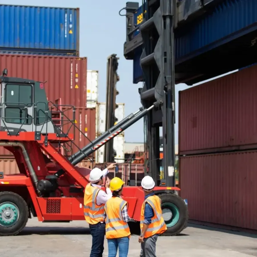 Container handler and workers at a port